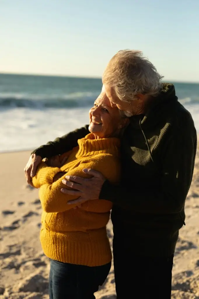 Old couple in love at the beach